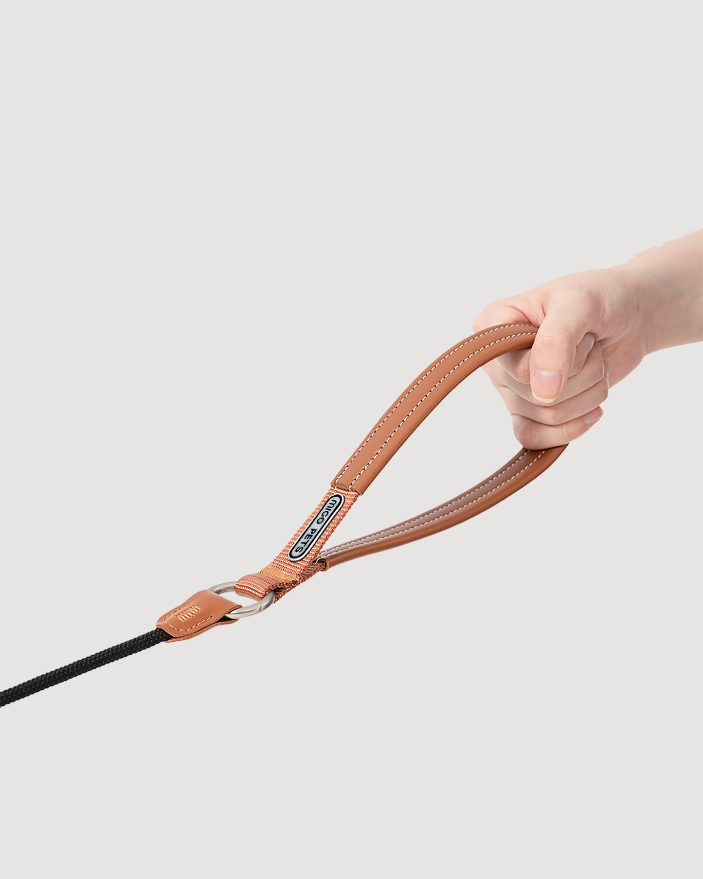 Close-up of the black dog slip lead, highlighting the soft leather handle.