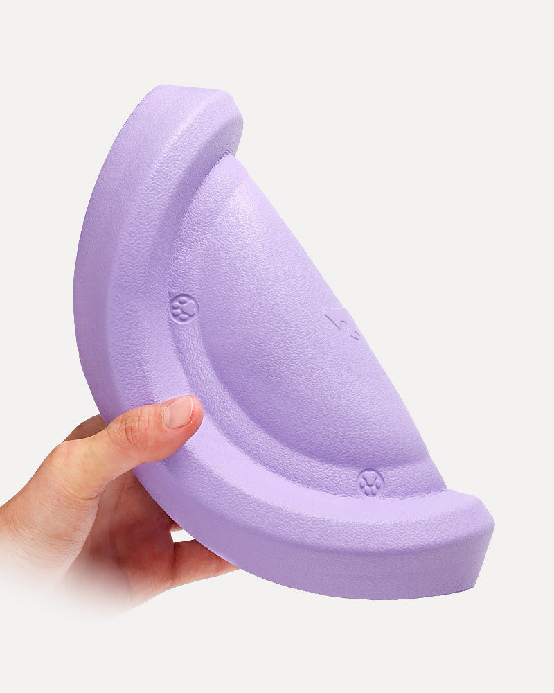 Close-up of the purple soft floating, easy-to-clean dog frisbee, highlighting its lightweight design for easy catching and biting.