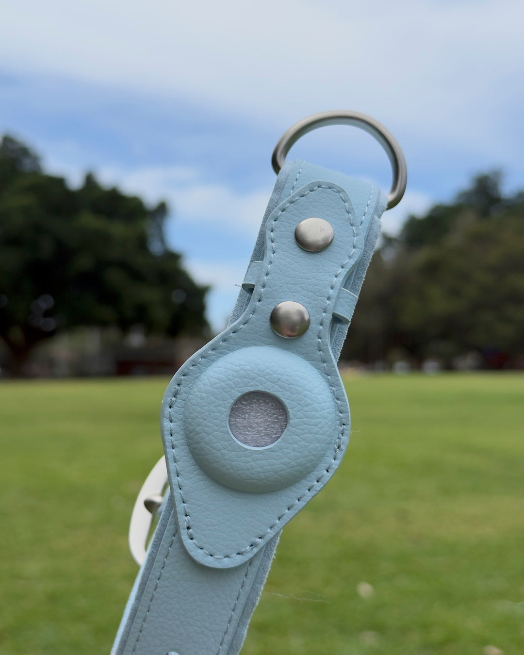 Sky Blue waterproof AirTag dog collar made from vegan leather with soft suede lining, suitable for everyday walks.