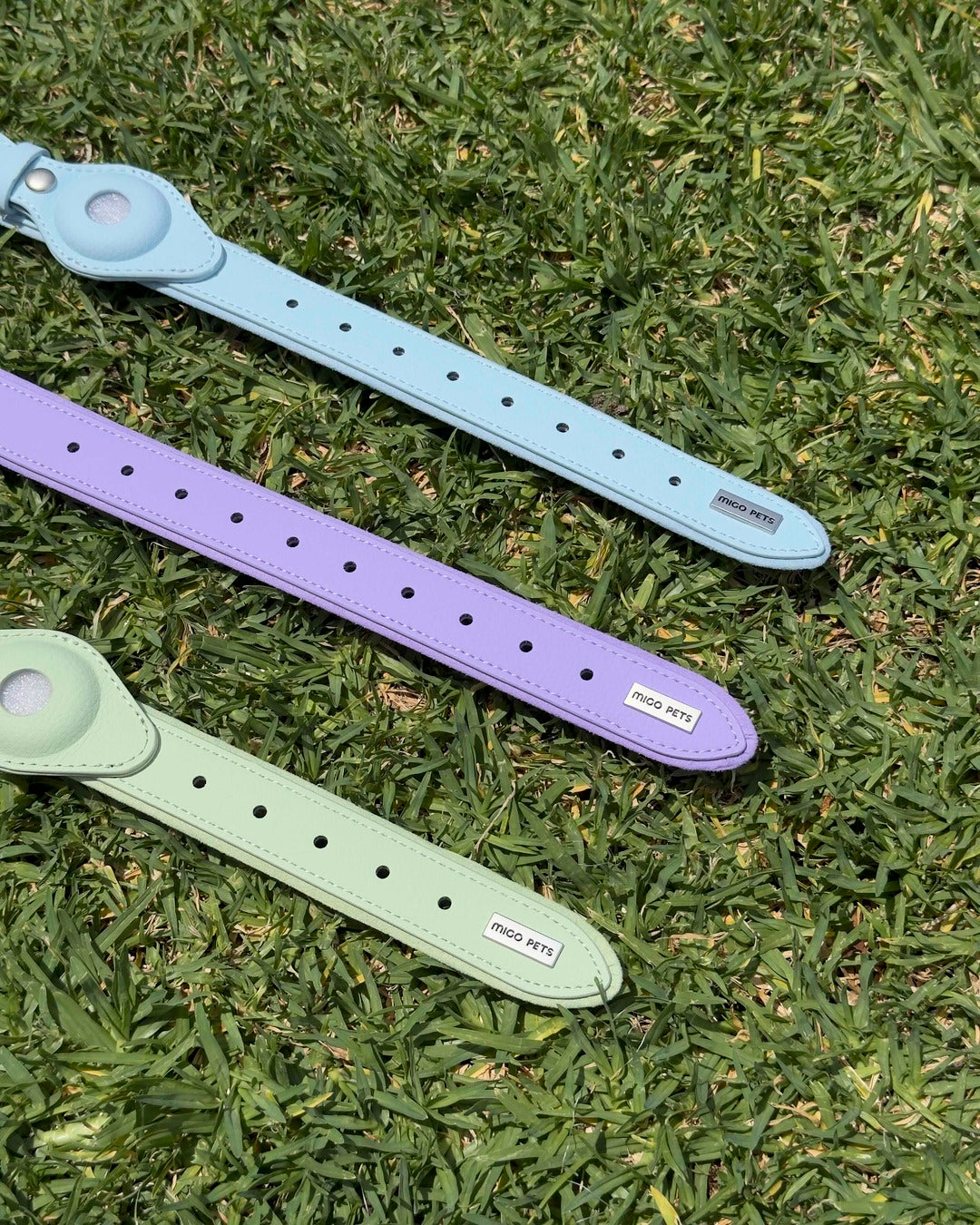 Waterproof dog AirTag collar in sky blue, sage green and soft purple, made from vegan leather