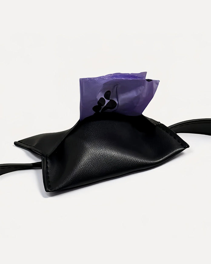 Close-up of black waterproof leather dog waste bag holder with purple waste.